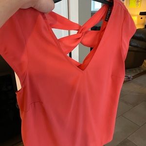 Cropped pink Express Top with detailed back